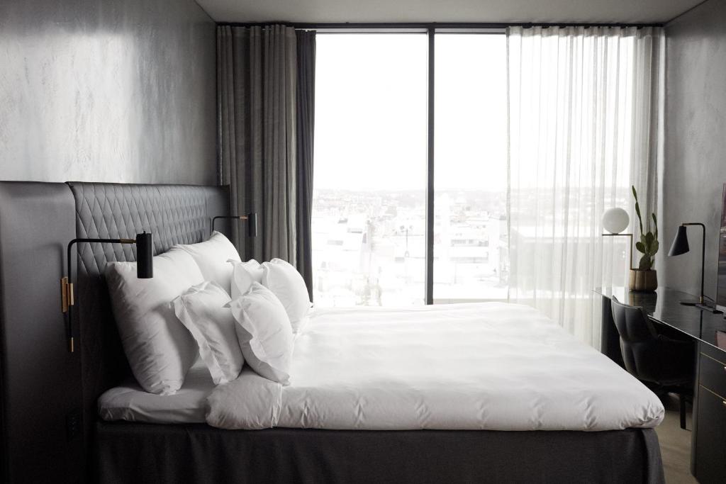 Petteri posing in the room at "at six" hotel.