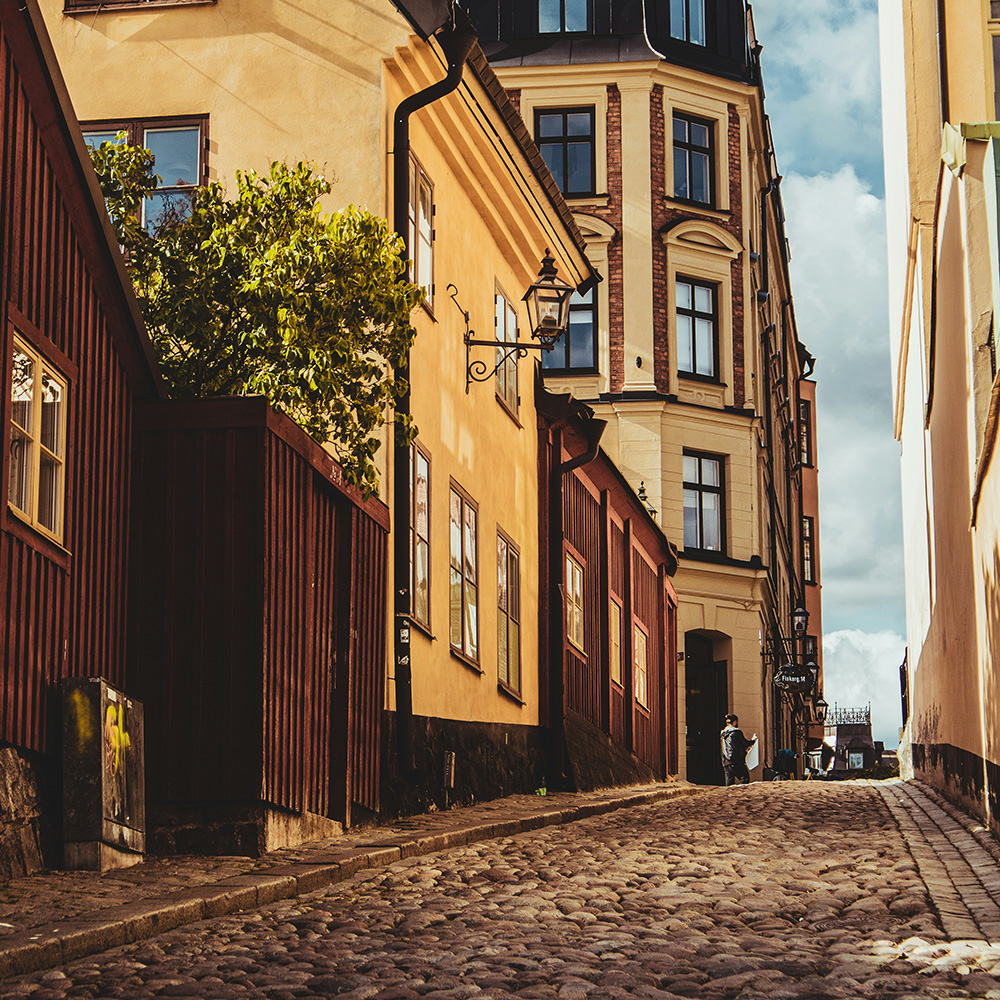 Old town of Stockholm with it's red wooden houses, yellow buildings and cobblestone roads.