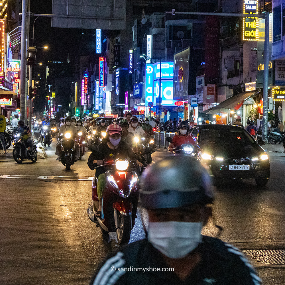 Knowing how to cross a busy street with motorbikes in Ho Chi Minh City is an importan travel tip for Vietnam.