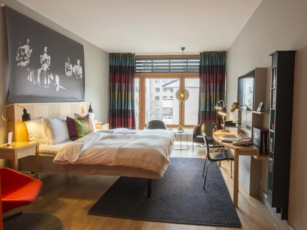 Homely hotel room at Hotel Rival with warm, home‑like décor.