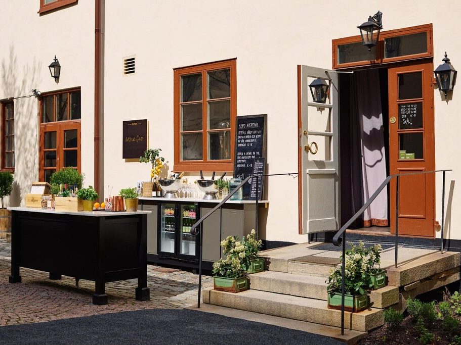 NOFO Hotel’s outdoor patio with seating for eating and drinking.