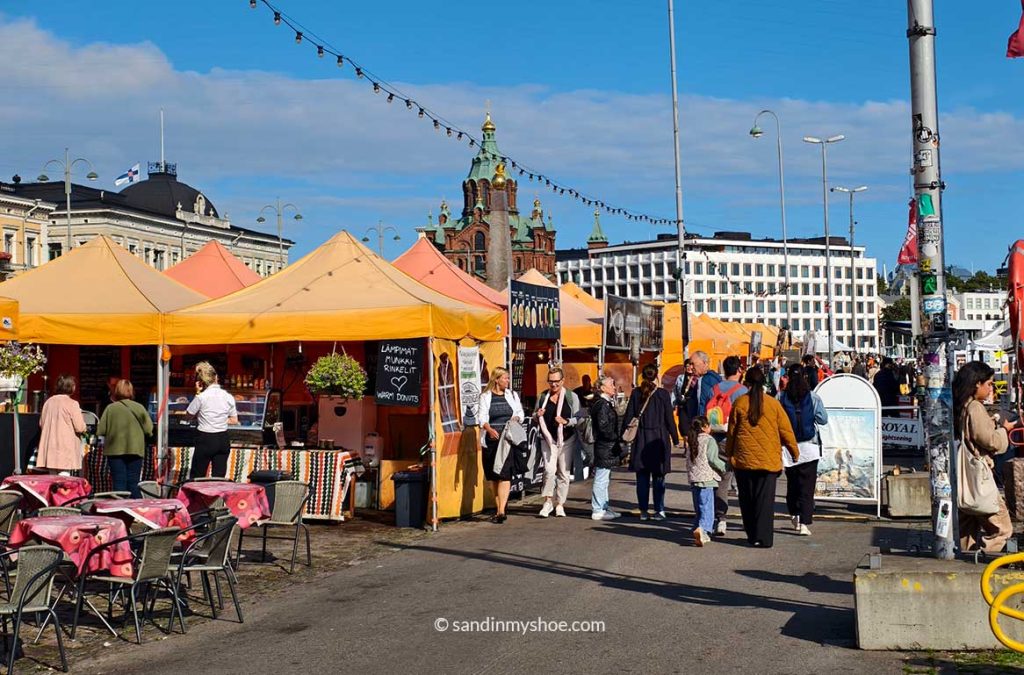 Market Square in Helsinki on a sunny day .