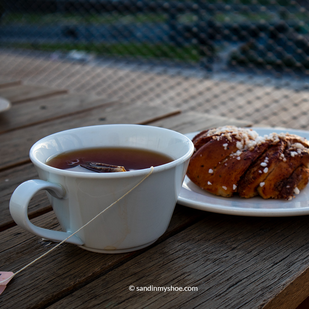 Coffee and pastry enjoyed on the cafรฉ that's on the top of Oodi library.