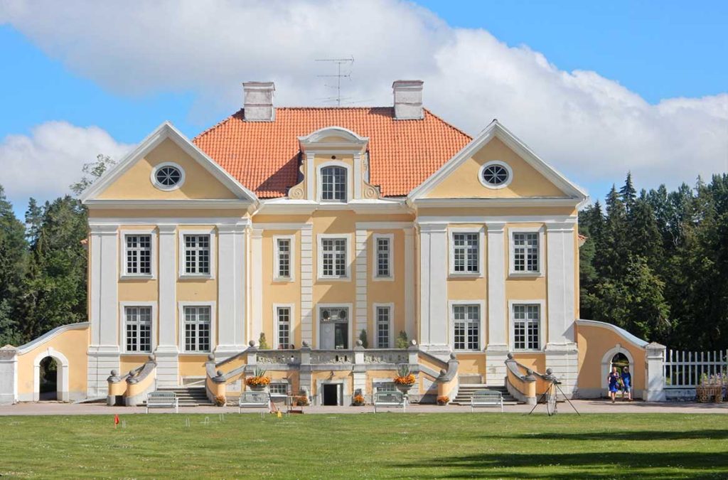 Palsme Manor house with its yellow facade.