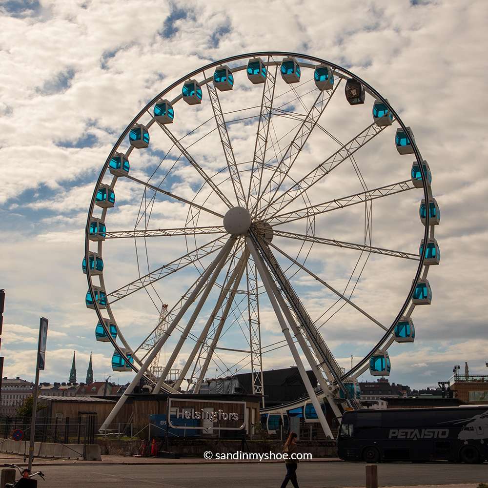 SkyWheel Helsinki with its distinctive sauna cabin overlooking the city's waterfront.